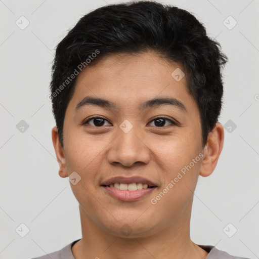 Joyful asian young-adult male with short  brown hair and brown eyes