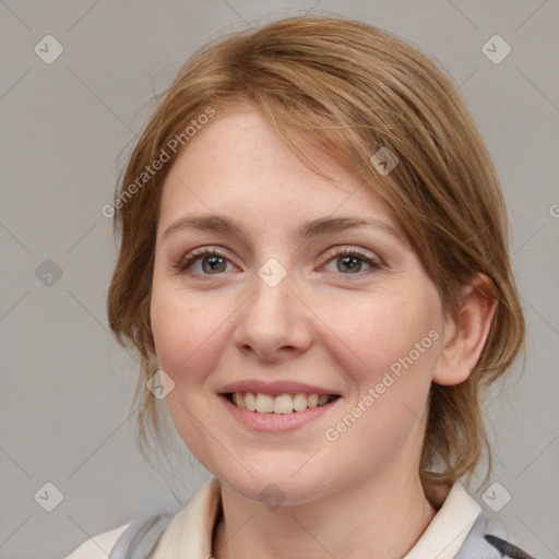 Joyful white young-adult female with medium  brown hair and blue eyes