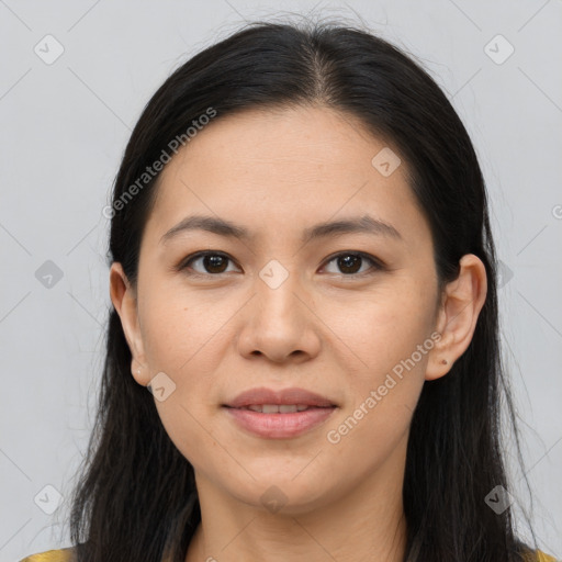 Joyful asian young-adult female with long  brown hair and brown eyes