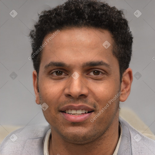 Joyful white young-adult male with short  black hair and brown eyes