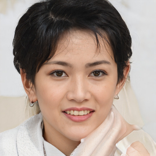 Joyful white young-adult female with medium  brown hair and brown eyes