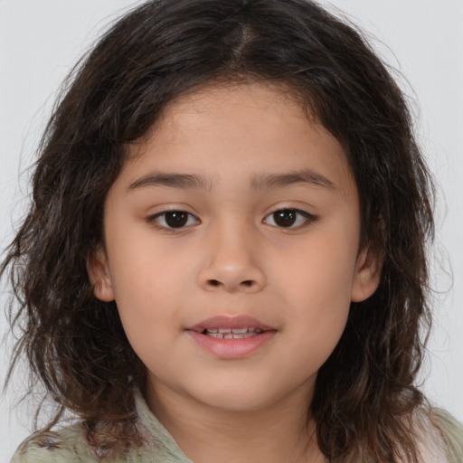 Joyful white child female with medium  brown hair and brown eyes