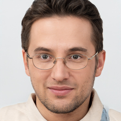 Joyful white adult male with short  brown hair and brown eyes