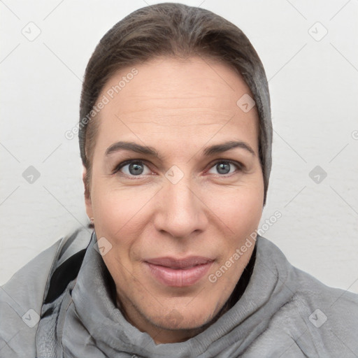 Joyful white adult female with short  brown hair and brown eyes