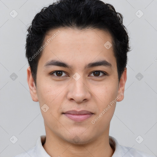 Joyful latino young-adult male with short  black hair and brown eyes