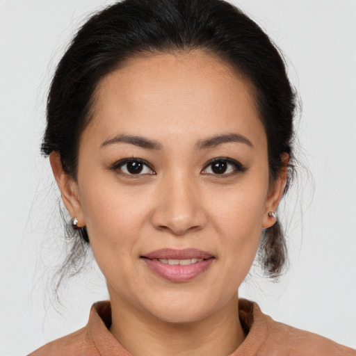Joyful white young-adult female with medium  brown hair and brown eyes