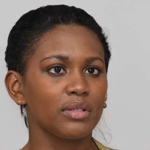 Joyful black young-adult female with medium  brown hair and brown eyes