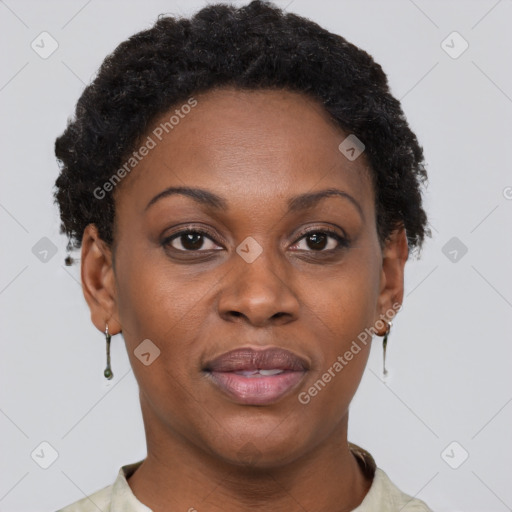 Joyful black adult female with short  brown hair and brown eyes