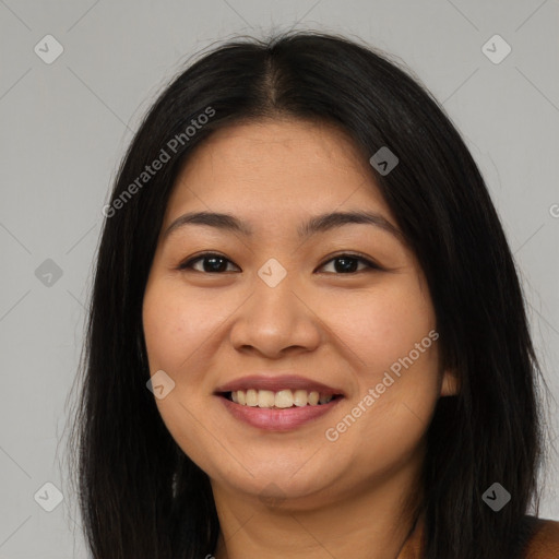 Joyful asian young-adult female with long  brown hair and brown eyes