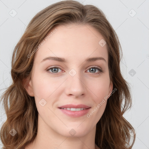 Joyful white young-adult female with long  brown hair and blue eyes