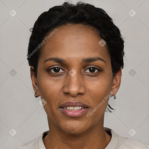 Joyful black young-adult female with short  black hair and brown eyes