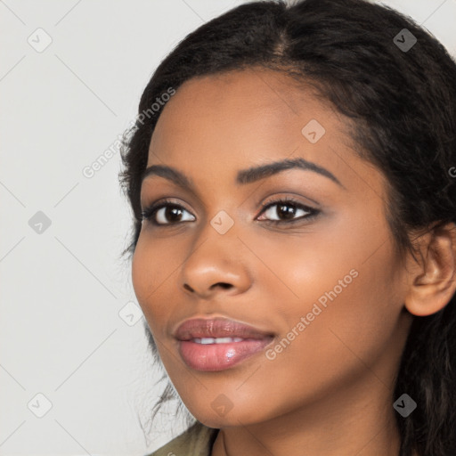 Joyful latino young-adult female with long  black hair and brown eyes