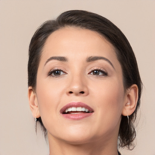 Joyful white young-adult female with medium  brown hair and brown eyes