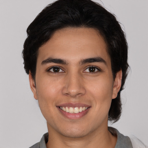 Joyful white young-adult male with medium  brown hair and brown eyes
