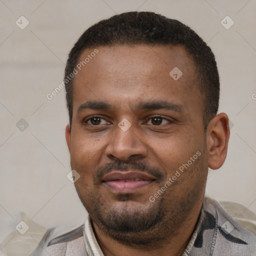 Joyful latino adult male with short  black hair and brown eyes