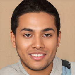 Joyful latino young-adult male with short  brown hair and brown eyes