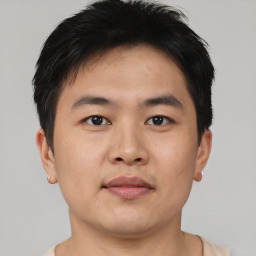 Neutral asian young-adult male with short  brown hair and brown eyes