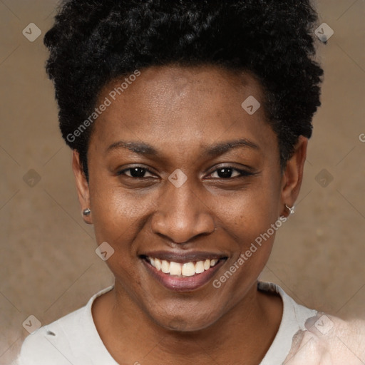Joyful black young-adult female with short  black hair and brown eyes