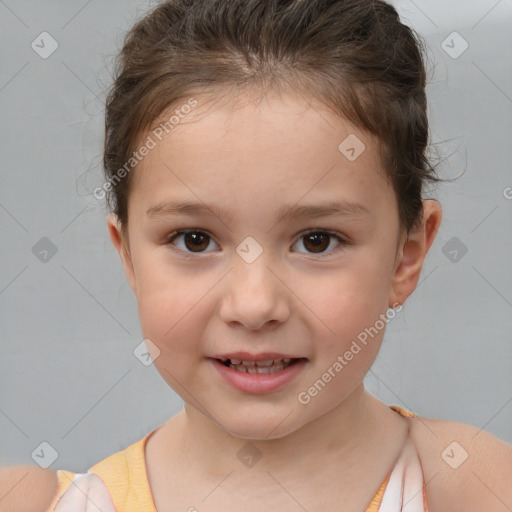 Joyful white child female with short  brown hair and brown eyes