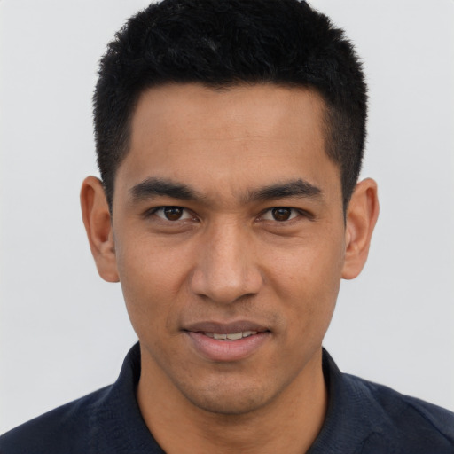 Joyful asian young-adult male with short  black hair and brown eyes