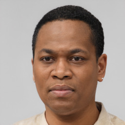 Neutral latino adult male with short  black hair and brown eyes