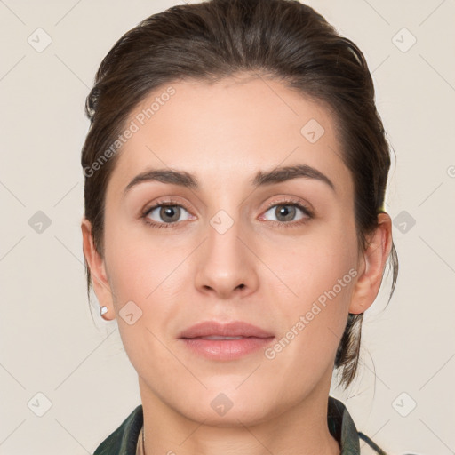 Joyful white young-adult female with medium  brown hair and grey eyes