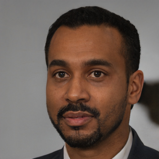 Neutral black young-adult male with short  black hair and brown eyes