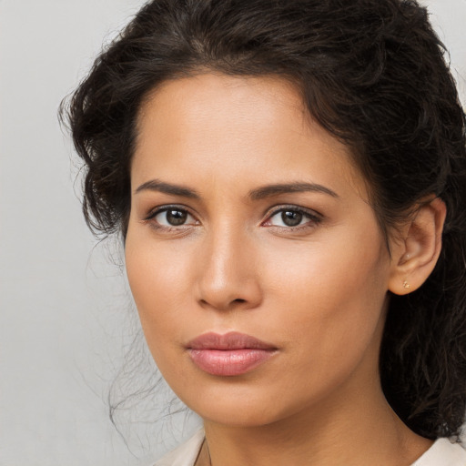 Neutral white young-adult female with long  brown hair and brown eyes