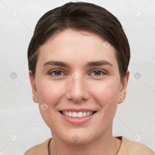 Joyful white young-adult female with short  brown hair and grey eyes