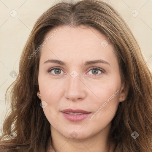 Joyful white young-adult female with long  brown hair and green eyes