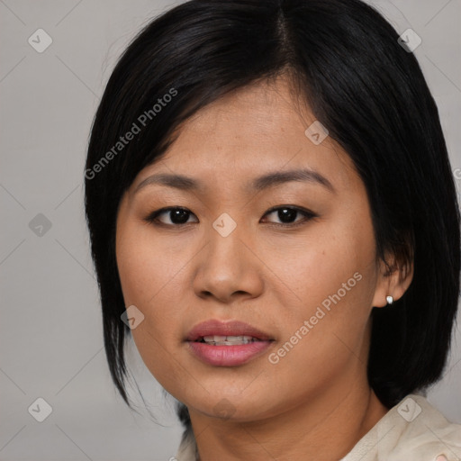 Joyful asian young-adult female with medium  black hair and brown eyes