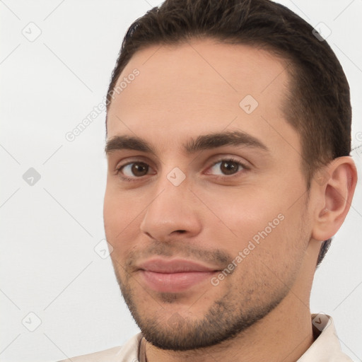 Joyful white young-adult male with short  brown hair and brown eyes