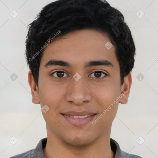 Joyful latino young-adult male with short  black hair and brown eyes