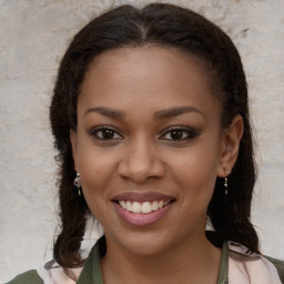 Joyful black young-adult female with medium  brown hair and brown eyes