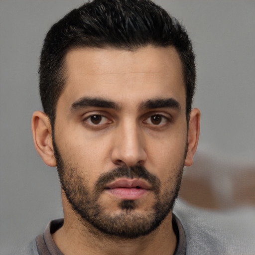 Neutral white young-adult male with short  black hair and brown eyes