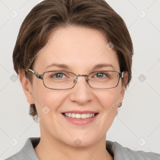 Joyful white adult female with short  brown hair and grey eyes