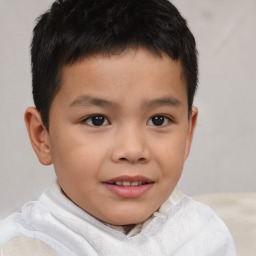 Joyful white child male with short  brown hair and brown eyes