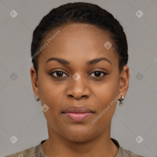 Joyful black young-adult female with short  black hair and brown eyes