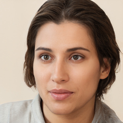 Neutral white young-adult female with medium  brown hair and brown eyes