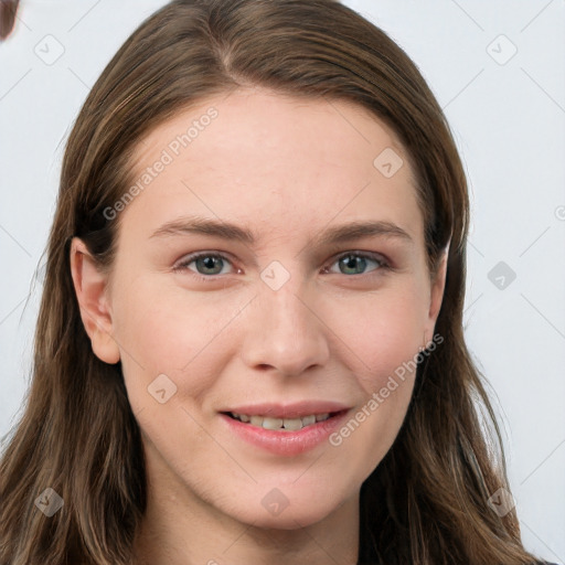 Joyful white young-adult female with long  brown hair and grey eyes