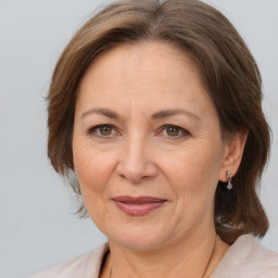 Joyful white adult female with medium  brown hair and brown eyes