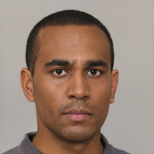 Neutral black young-adult male with short  black hair and brown eyes