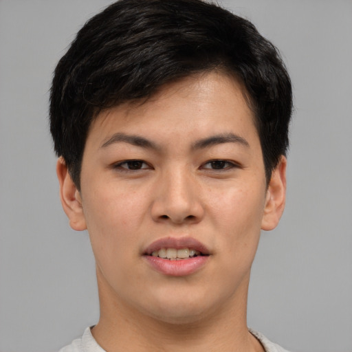 Joyful asian young-adult female with short  brown hair and brown eyes