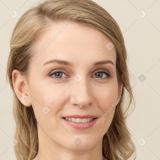 Joyful white young-adult female with long  brown hair and green eyes