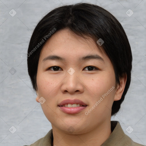 Joyful asian young-adult female with short  brown hair and brown eyes