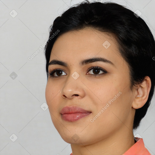 Joyful latino young-adult female with short  black hair and brown eyes