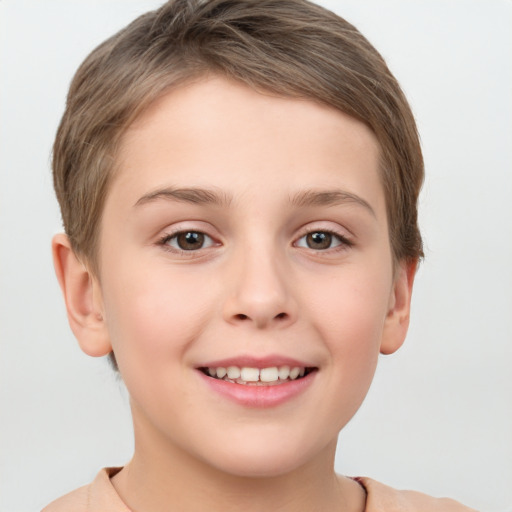 Joyful white child female with short  brown hair and brown eyes