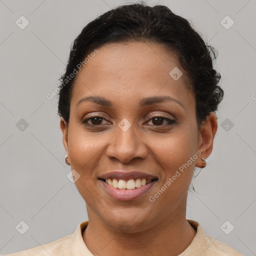 Joyful latino adult female with short  brown hair and brown eyes