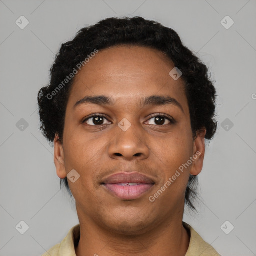 Joyful black young-adult female with short  black hair and brown eyes