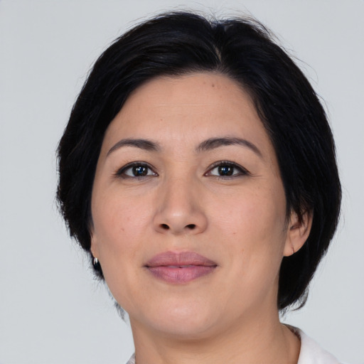 Joyful asian young-adult female with medium  black hair and brown eyes